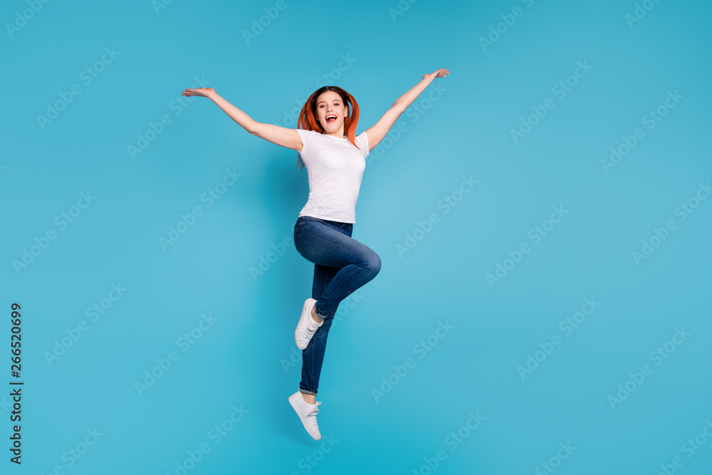Full length body size view portrait of her she nice attractive cheerful cheery girlish girl wearing white tshirt having fun celebrate day isolated over bright vivid shine blue background
