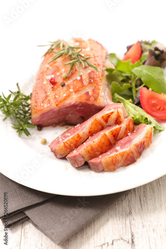 grilled duck steak with lettuce