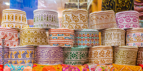 Colorful Omani Caps on retail display during Ramadan.
