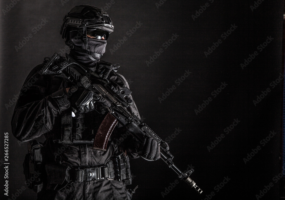Elite police squad member in tactical ammunition Elite police squad member in tactical ammunition