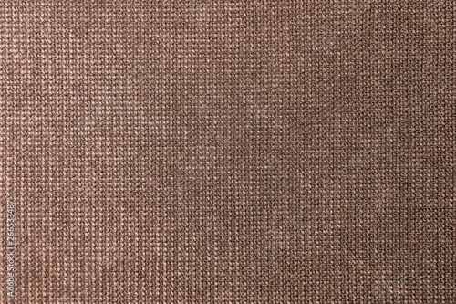 Textured background large brown textile. Texture of textile fabric close-up