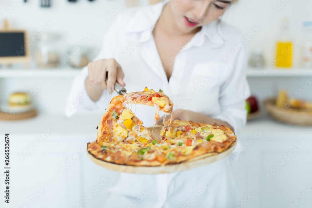 woman enjoying pizza