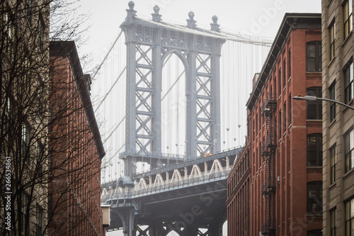 Fototapeta Naklejka Na Ścianę i Meble -  The famous view of the Manhattan bridge at Dumbo in the streets of Brooklyn - New York City, NY