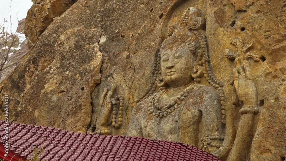 extreme close-up straight still shot of Maitreya Buddha, the famous Chamba statue at Mulbekh monastery, Kargil Leh road. extreme close-up straight still shot of Maitreya Buddha, the famous Chamba statue at Mulbekh monastery, Kargil Leh road.