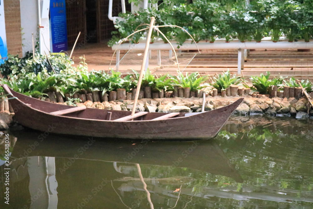 Old wooden boat on lake bank