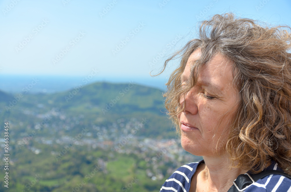 Side view portrait of a middle-aged serene woman Side view portrait of a middle-aged serene woman