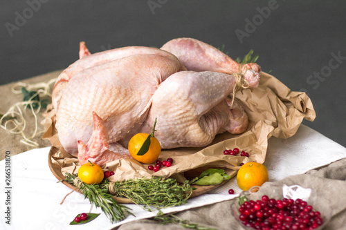 Fresh raw turkey in a roasting pan ready for the oven.