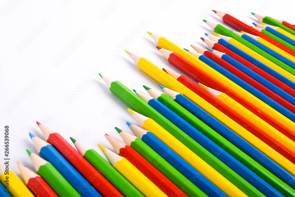 Many different colored pencils on a white background with a place for text and cory space . Many different colored pencils on a white background with a place for text and cory space .