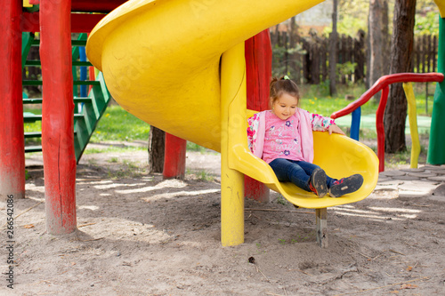 Cute Baby playing Outdoors in a Park on Vacation, Little Girl Playing fun.  - Image