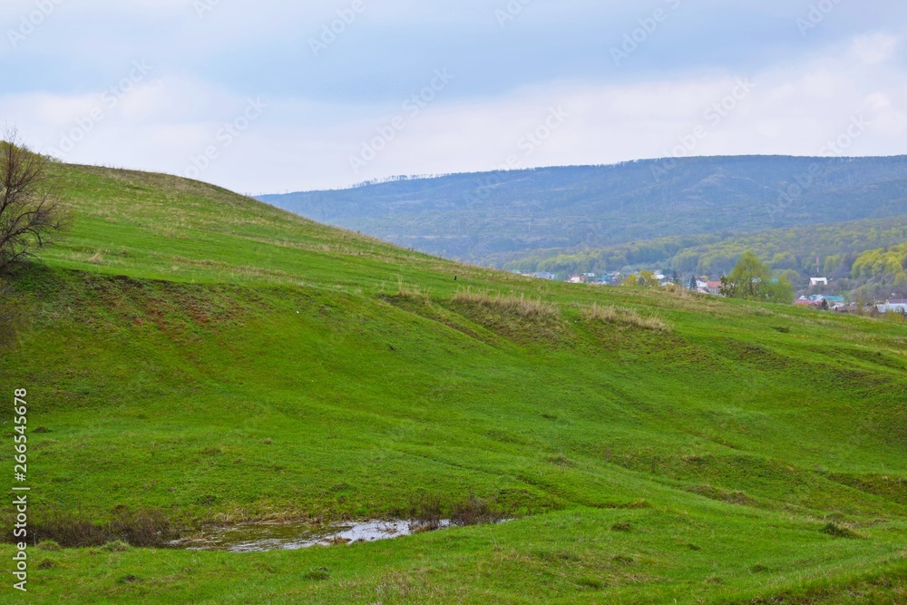 Village in the mountains.Beautiful spring landscape. Village in the mountains.Beautiful spring landscape.