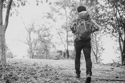 Man traveling with backpack hiking in mountains. Man backpacker hiking in mountains alone outdoor active lifestyle travel adventure vacations.