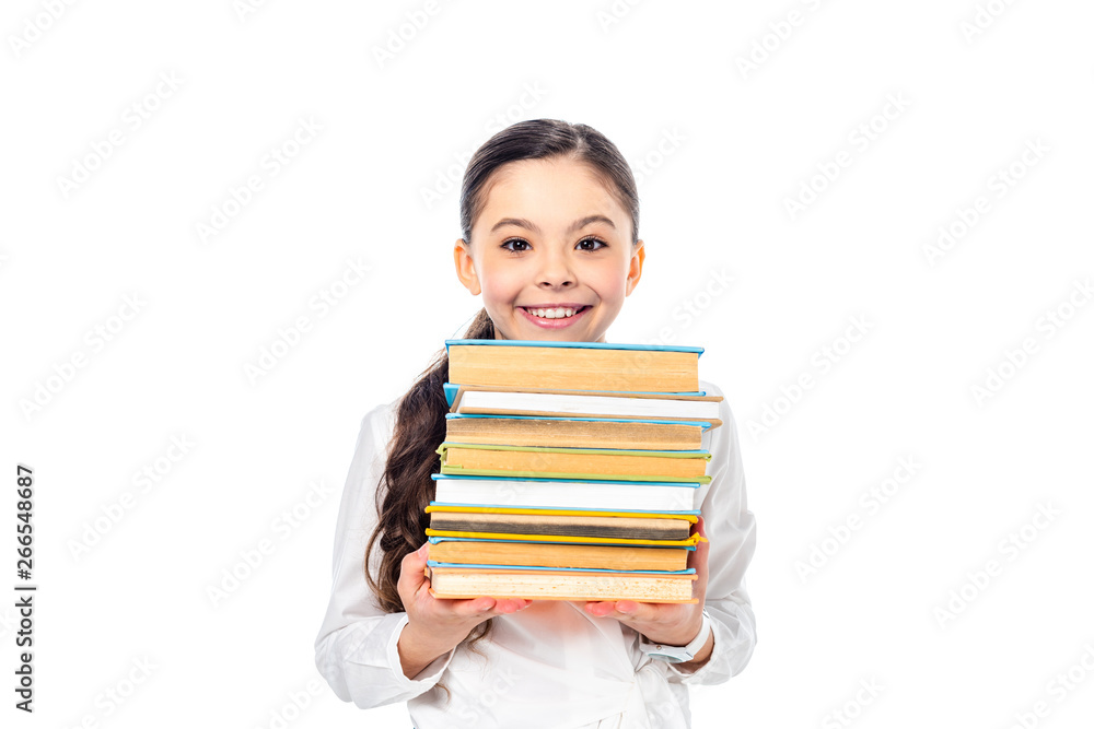 smiling schoolgirl holding books and looking at camera Isolated On White smiling schoolgirl holding books and looking at camera Isolated On White