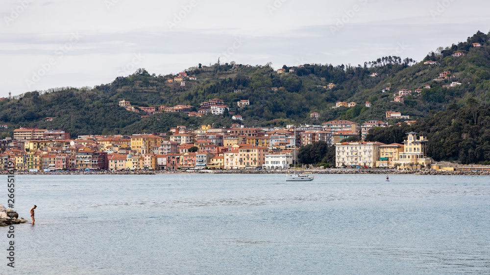 LERICI, LIGURIA/ITALY  - APRIL 21 : View across the bay fromLerici in Liguria Italy on April 21, 2019. Unidentified people