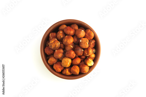 bowl full of hazelnuts isolated on a white background