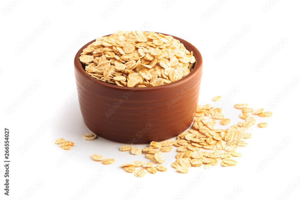 Bowl full of flaked oats on a white background Bowl full of flaked oats on a white background