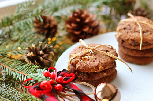 Christmas decorations - oat biscuits for Santa Claus and branches of coniferous trees
