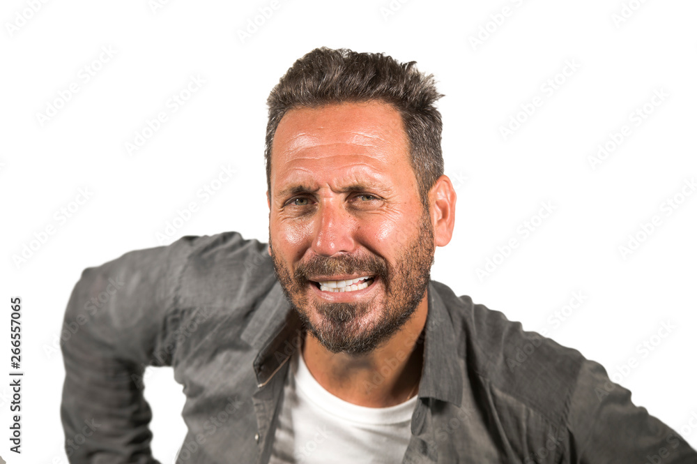 Obraz premium young happy and handsome 40s man with blue eyes and beard in casual shirt posing in cool attitude smiling cheerful and confident isolated on white studio background