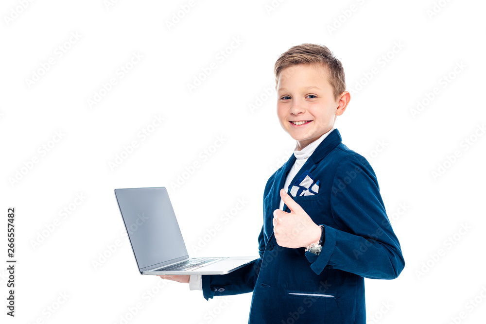 happy schoolboy in businessman suit with laptop showing thumb up Isolated On White happy schoolboy in businessman suit with laptop showing thumb up Isolated On White