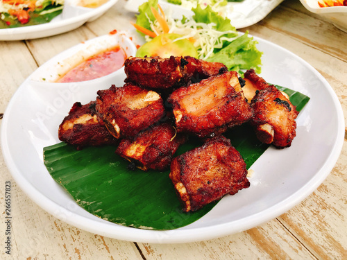 Fried pork sparerib baked in brandy sauce.