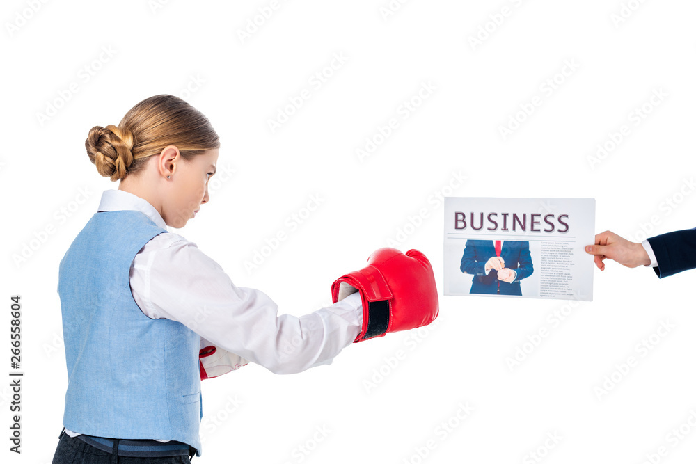schoolgirl in boxing gloves and hand of schoolboy with business newspaper Isolated On White schoolgirl in boxing gloves and hand of schoolboy with business newspaper Isolated On White