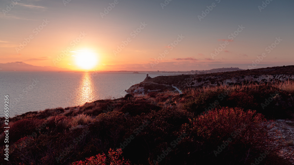 Sunset over the coast and hill of Calamosca 