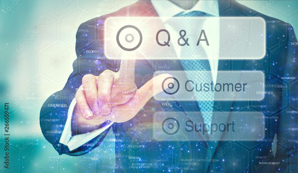 A business man selection a Q & A button on a futuristic display with a concept written on it. A business man selection a Q & A button on a futuristic display with a concept written on it.