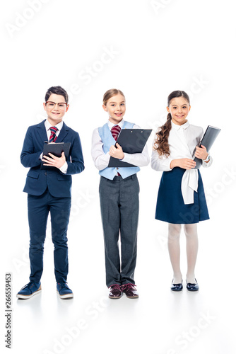 smiling schoolchildren with clipboards pretending to be businesspeople On White
