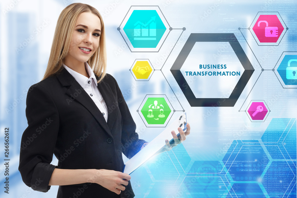 The concept of business, technology, the Internet and the network. A young entrepreneur working on a virtual screen of the future and sees the inscription: Business transformation The concept of business, technology, the Internet and the network. A young entrepreneur working on a virtual screen of the future and sees the inscription: Business transformation