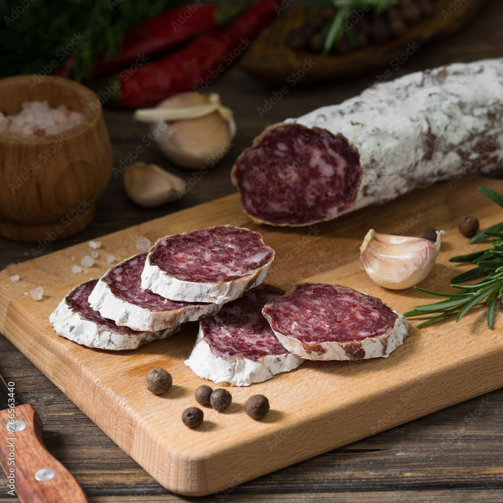 Sausage on a wooden Board in a rustic style Sausage on a wooden Board in a rustic style