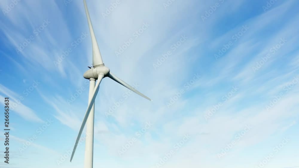 Flying around of the slow rotating windmill - blue skies background with very almost no white clouds, Northern Sweden, ecological energy production. Close to Umea city Flying around of the slow rotating windmill - blue skies background with very almost no white clouds, Northern Sweden, ecological energy production. Close to Umea city