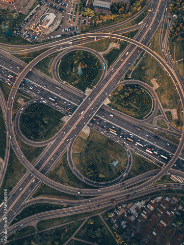 Aerial view from above of an urban landscape. Drone shot of highway intersections