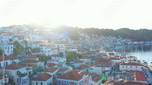 Poros Greece.Sunny morning in Greek island. Backlight dynamic aerial video footage. © Iryna&Maya