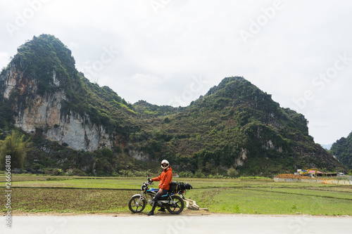 Motorbiker sitting on Motorbike in the North of Vietnam