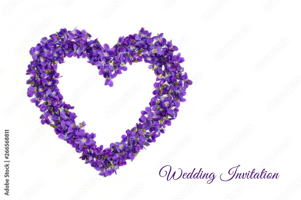 Wedding invitation card. Delicate spring violets in the shape of a heart on a white background