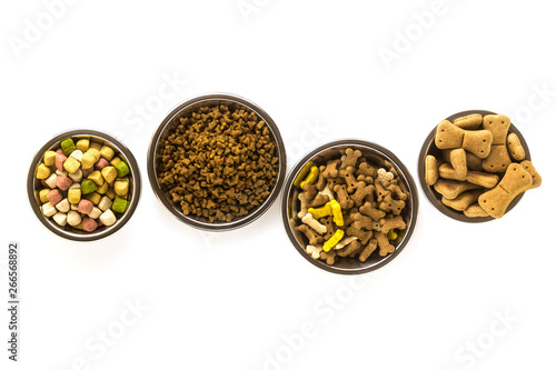 pet food in bowls and toys isolated on white background