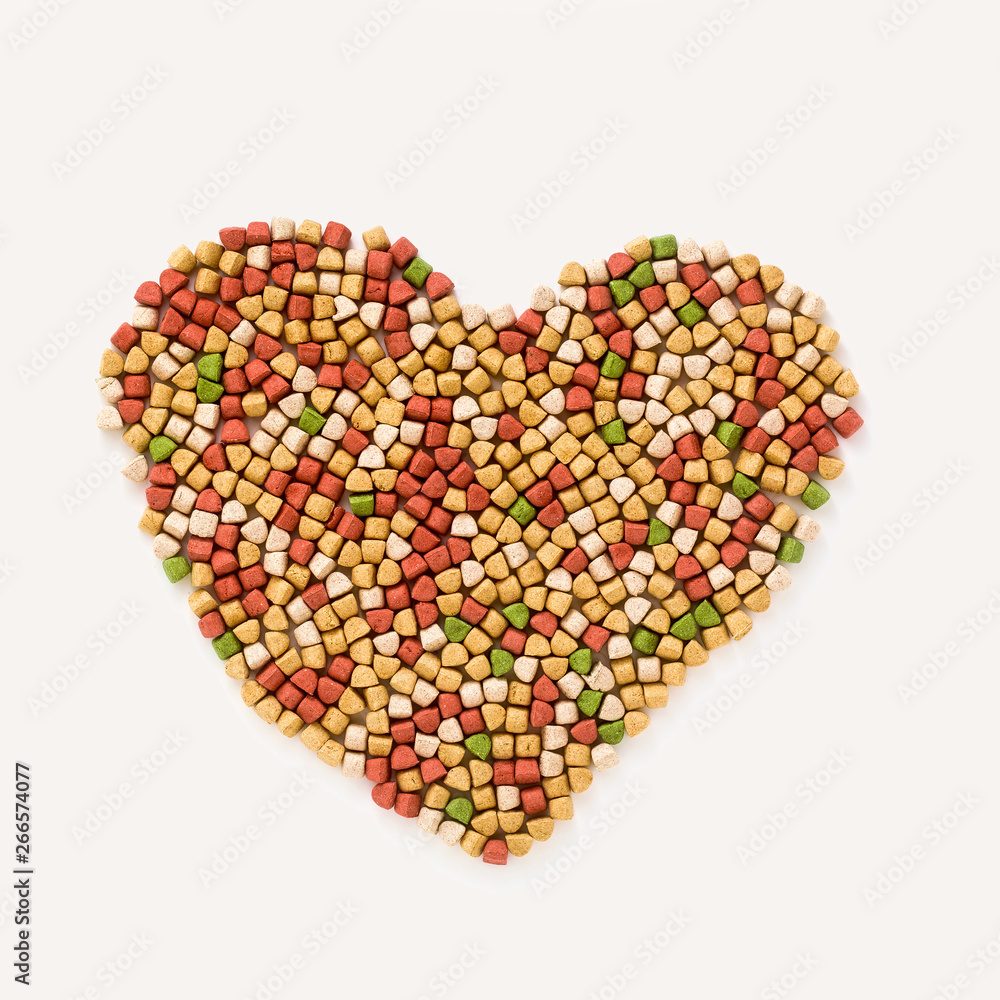 dry pet food in the shape of a heart shape isolated on white background dry pet food in the shape of a heart shape isolated on white background