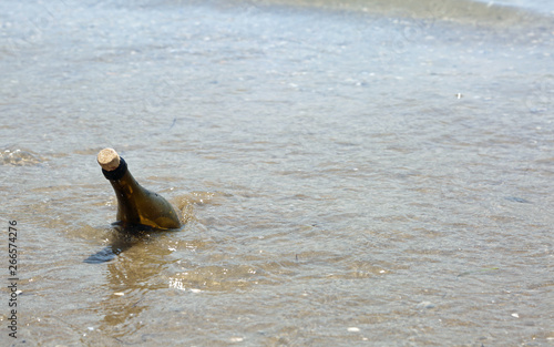 one bottle of glass on the sea