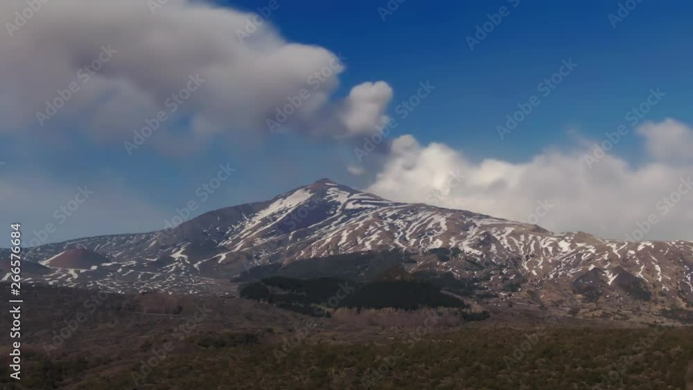 Aerial dolly view of mount Etna in Sicily with snow in winter Aerial dolly view of mount Etna in Sicily with snow in winter