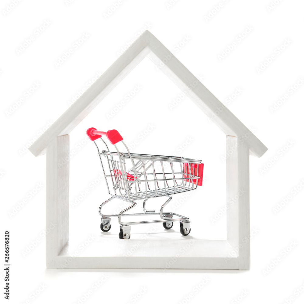 Shopping cart with house isolated on white background.