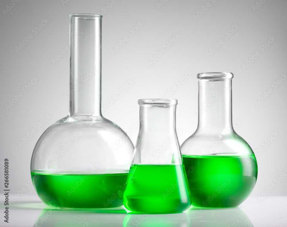 laboratory flask with green liquid laboratory flask with green liquid
