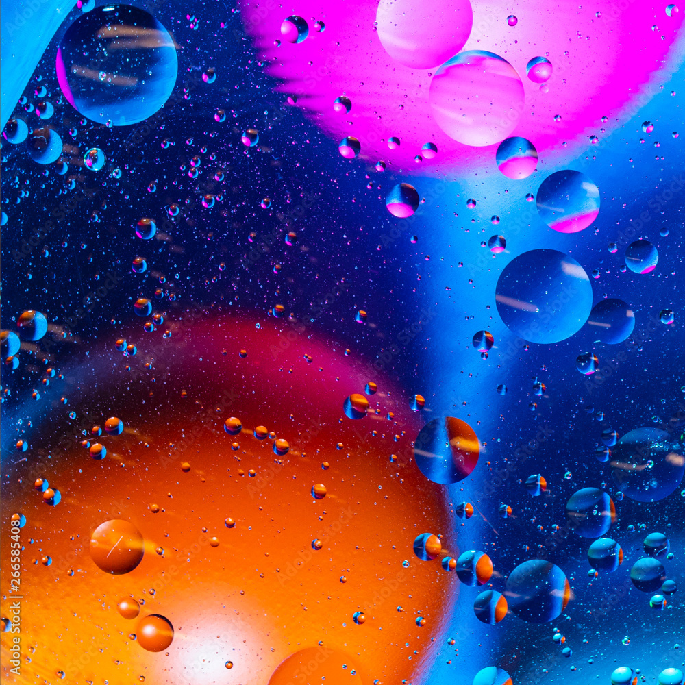 Mixing water and oil on a beautiful color abstract background gradient balls circles and ovals Mixing water and oil on a beautiful color abstract background gradient balls circles and ovals