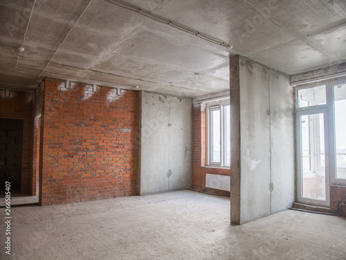 Concrete and brick walls in the apartment for repair