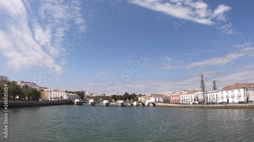 Zoom out of the Roman bridge over the Gilao River in Tavira, Algarve, Portugal.