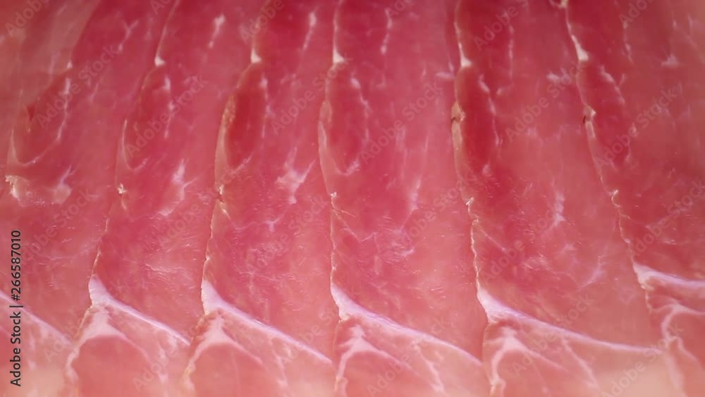 Prosciutto crudo ham on rotating plate seamless looping hd background cover video Prosciutto crudo ham on rotating plate seamless looping hd background cover video
