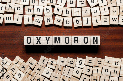 Oxymoron word concept on cubes photo