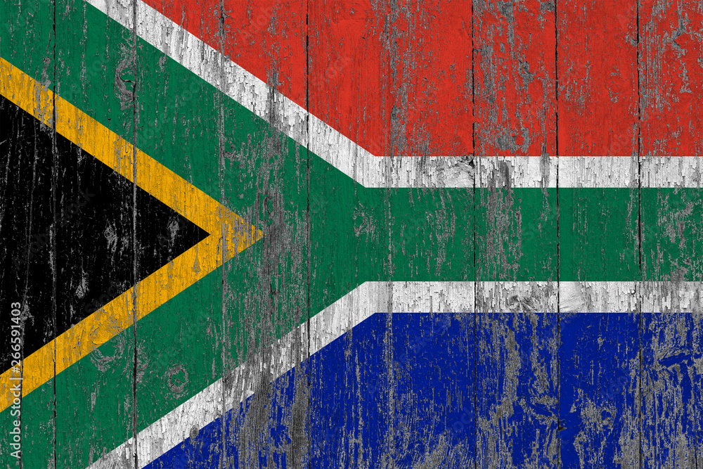 Flag of South Africa painted on worn out wooden texture background.