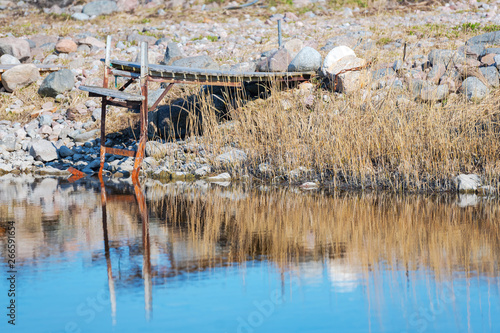 Small weathered jetty in ru...