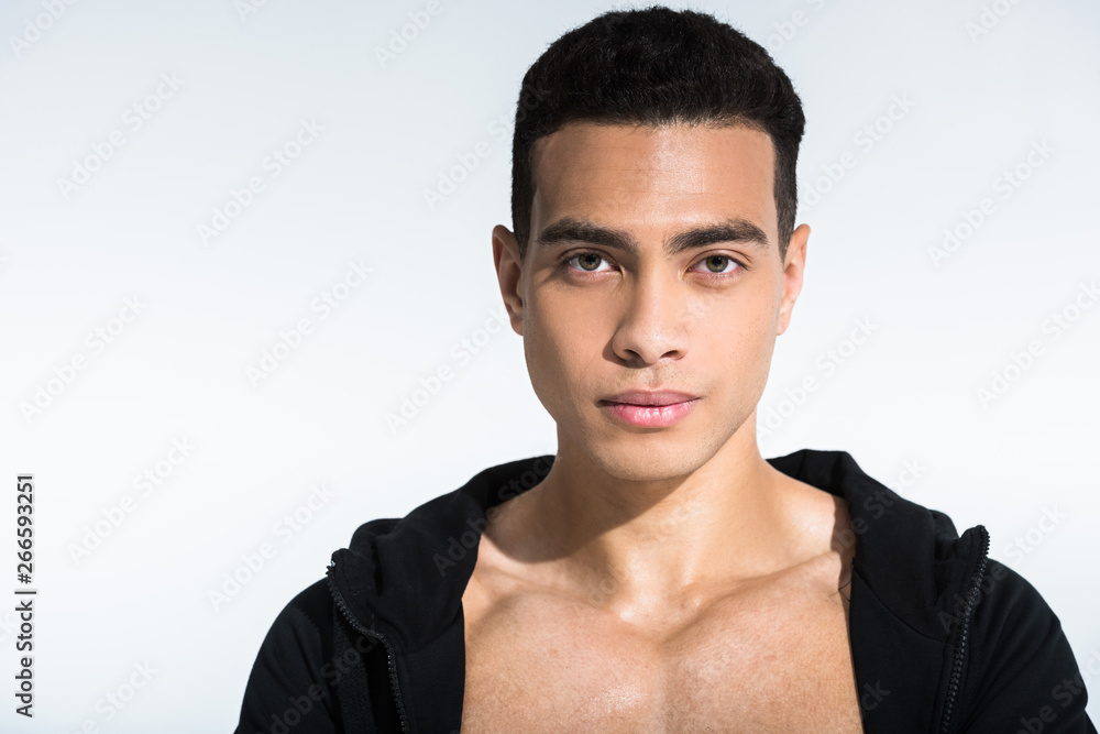 handsome mixed race man in black sports jacket looking at camera on white handsome mixed race man in black sports jacket looking at camera on white