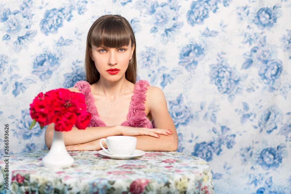 Portrait of gorgeous sensual blonde woman in fashion dress with cup of coffee or tea Portrait of gorgeous sensual blonde woman in fashion dress with cup of coffee or tea