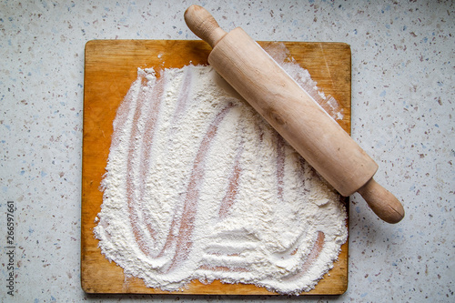 flour and rolling pin on the kitchen table